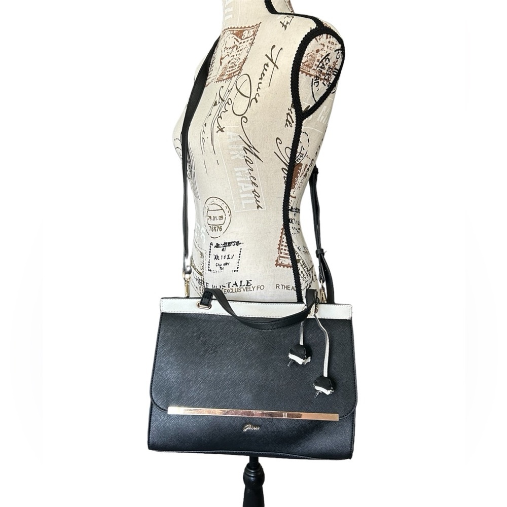 GUESS black and white vegan leather purse with gold and flower det…